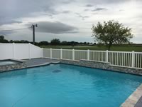 4 foot closed picket vinyl pool fence & 6 foot privacy vinyl fence around a pool area