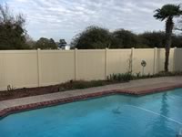 6 foot tall solid vinyl privacy fence around a pool area