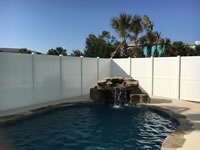 8 foot tall solid vinyl privacy fence enclosing a pool area