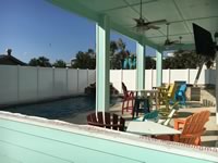 8 foot tall solid vinyl privacy fence enclosing a pool area