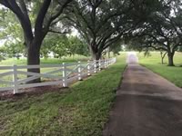 Ranch style vinyl fence made in a X configuration